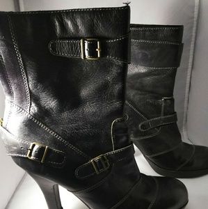 Black leather high heeled boots